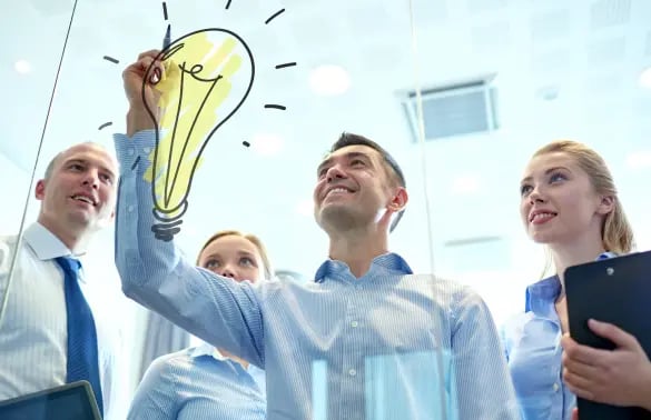 business-people-teamwork-planning-concept-smiling-business-team-with-marker-light-bulb-doodle-working-office 1